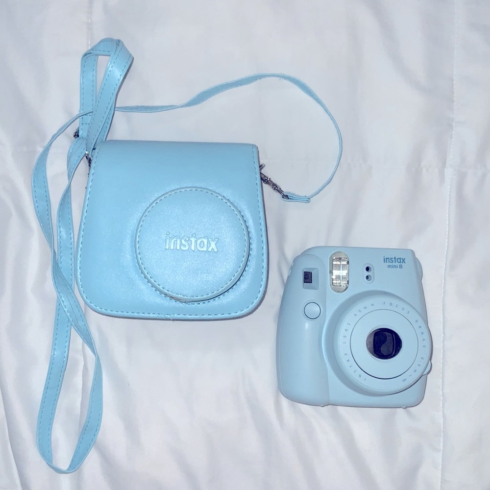 Fujifilm blue Instax Mini 8 with matching carrier bag